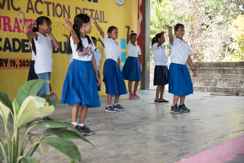 U.S. Navy Seabees with NMCB-5’s Detail Palawan attend the ribbon cutting ceremony at Malatgao Elementary School