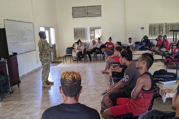 U.S. Navy Seabees with NMCB-5’s Detail Yap speak to local students