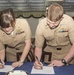SWO couple signs department head retention bonus contract together