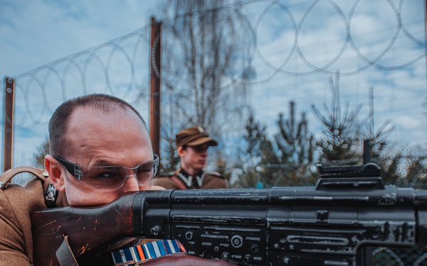 NATO eFP Battle Group Poland Soldiers honor the Polish Cursed Soldiers during Remembrance Day
