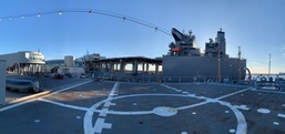 USNS Hershel "Woody" Williams (T-ESB-4) docked behind Naval Museum