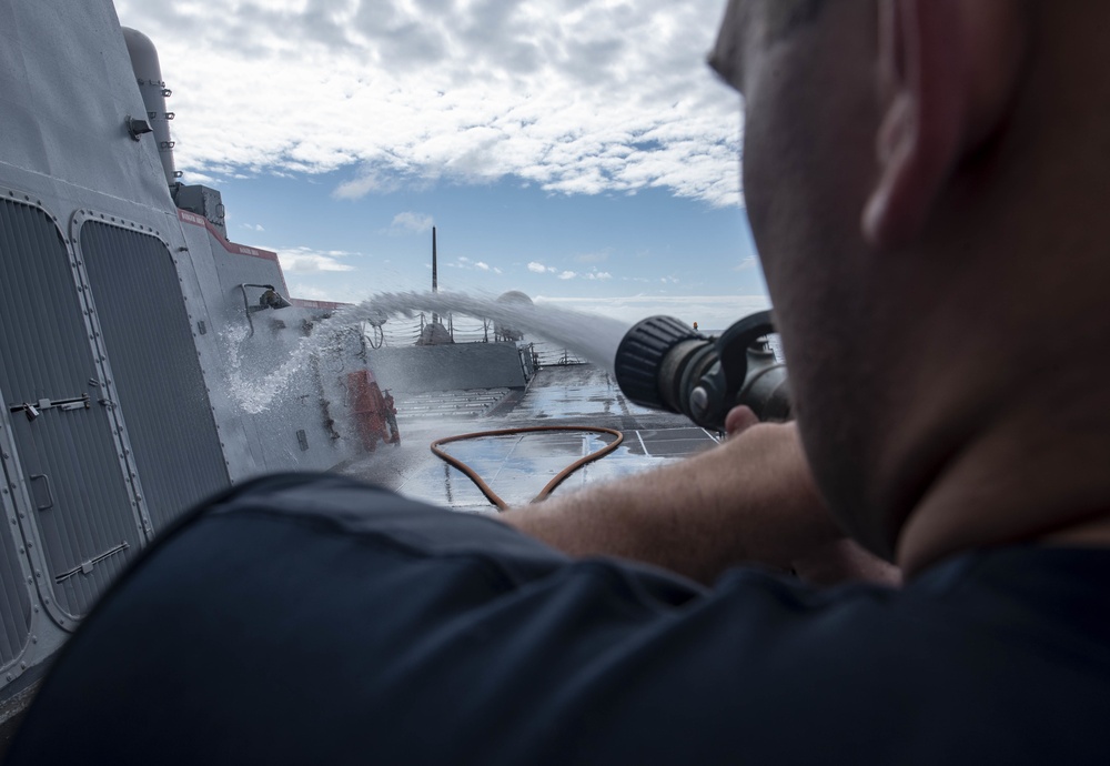 Sailor Performs Fresh Water Washdown