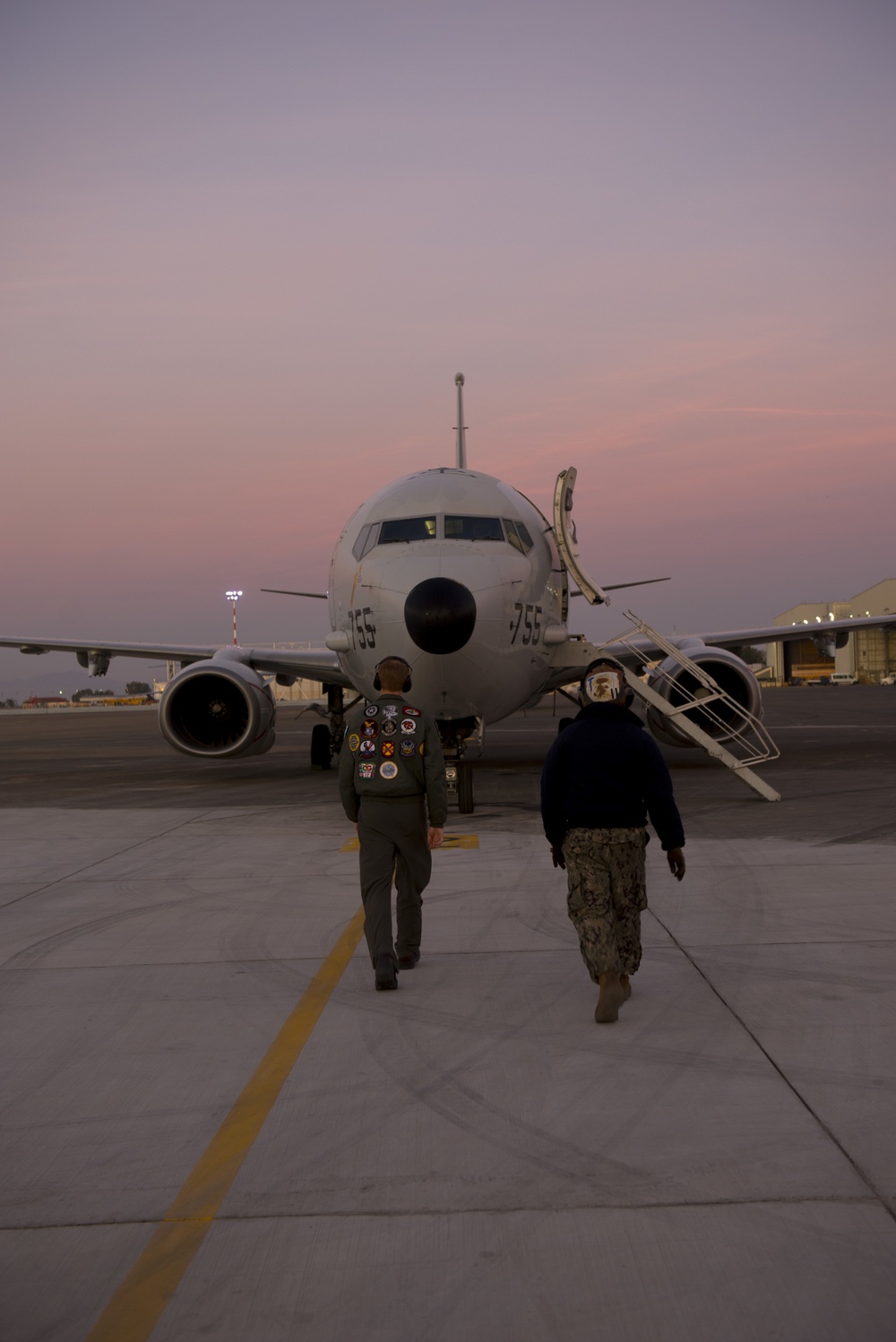 Plane Captain and Patrol Plane Commander Perform Walk Around Inspection