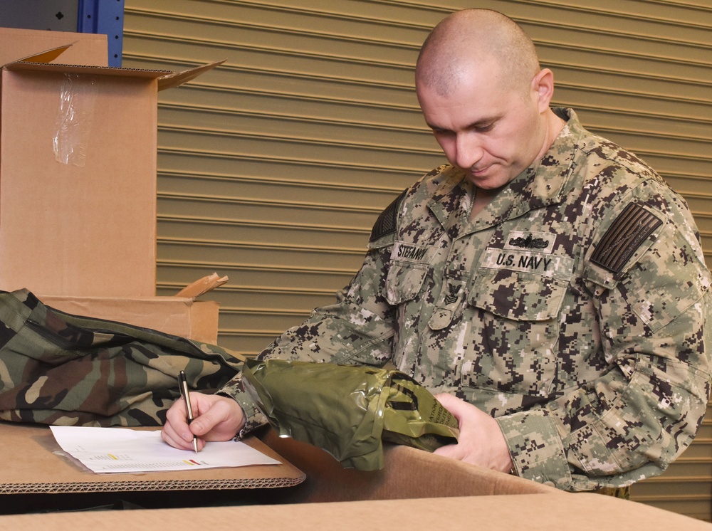 Damage Controlman 1st Class Petko Stefanov performs inventory checks