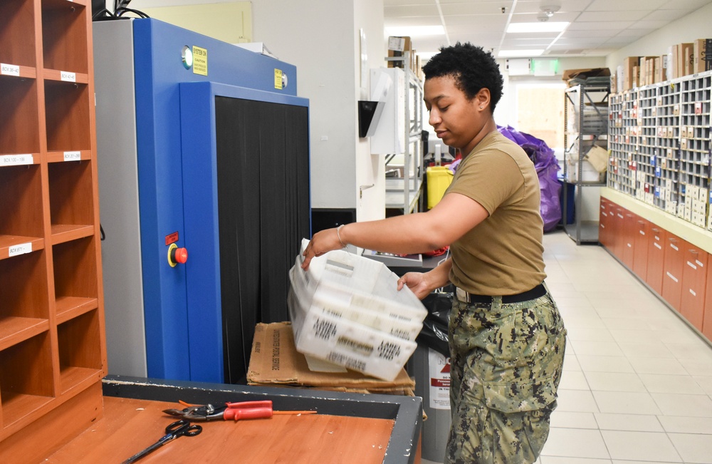 Logistics Specialist Seaman Recruit Daanzae Blandwarren sorts mail