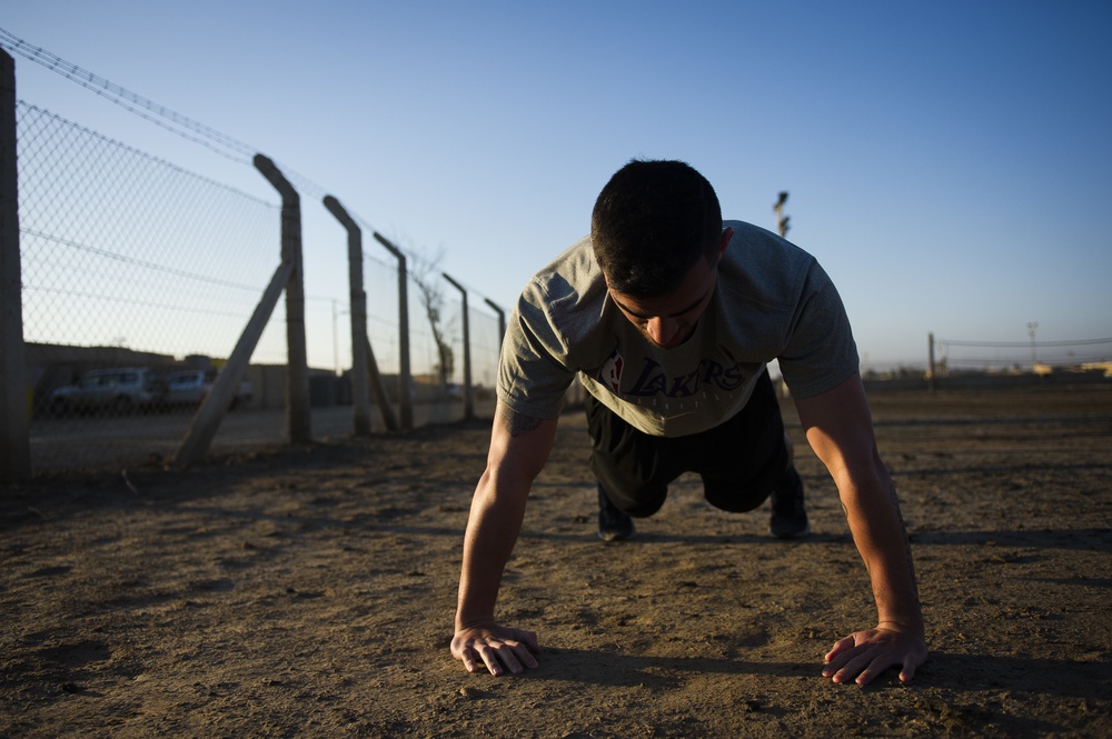 Soldier does physical training at Camp Taji