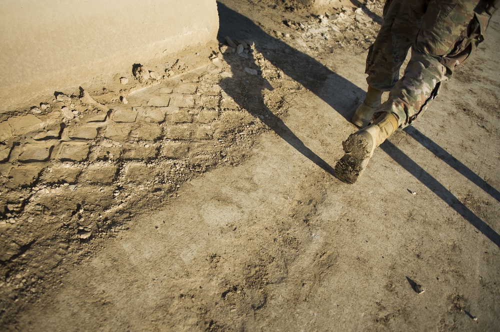 Soldier does physical training at Camp Taji
