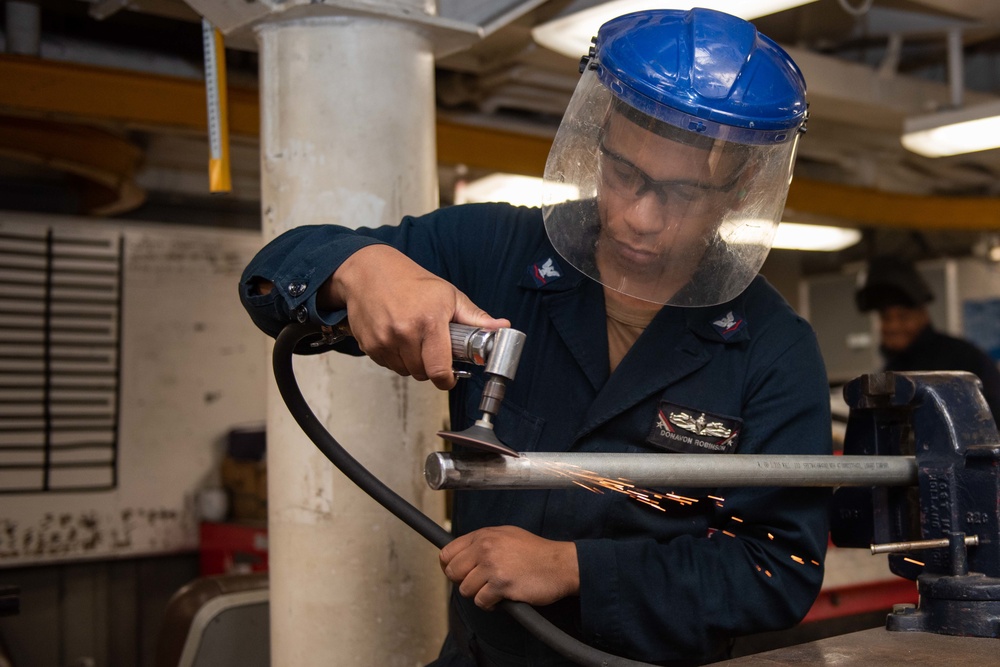 Navy Hull Maintenance Technician grinds