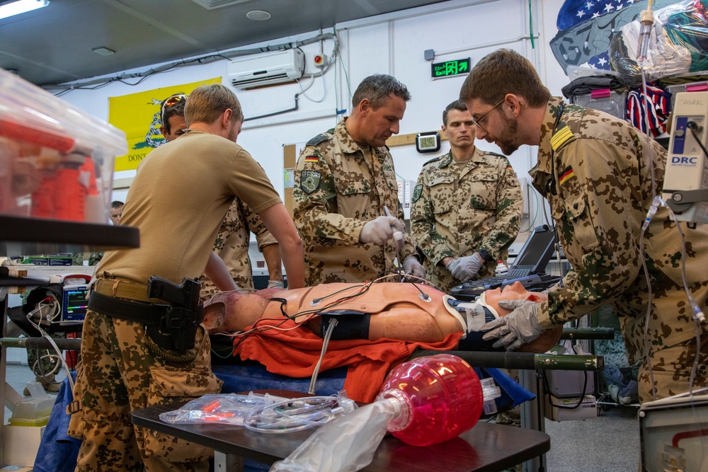 Physicians demonstrate medical procedure for local health care workers