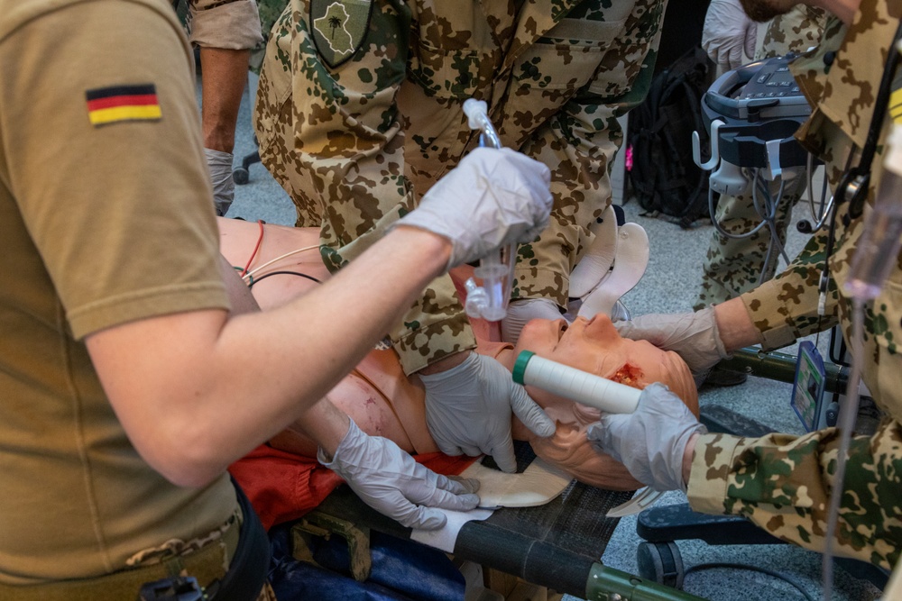 Physicians demonstrate medical procedure for local health care workers