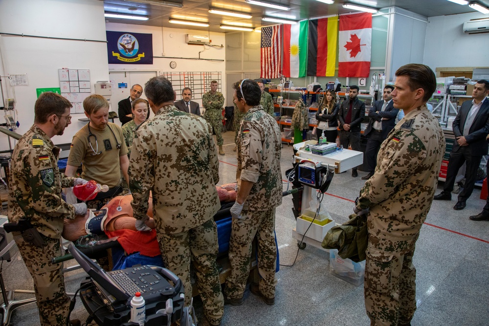 Physicians demonstrate medical procedure for local health care workers