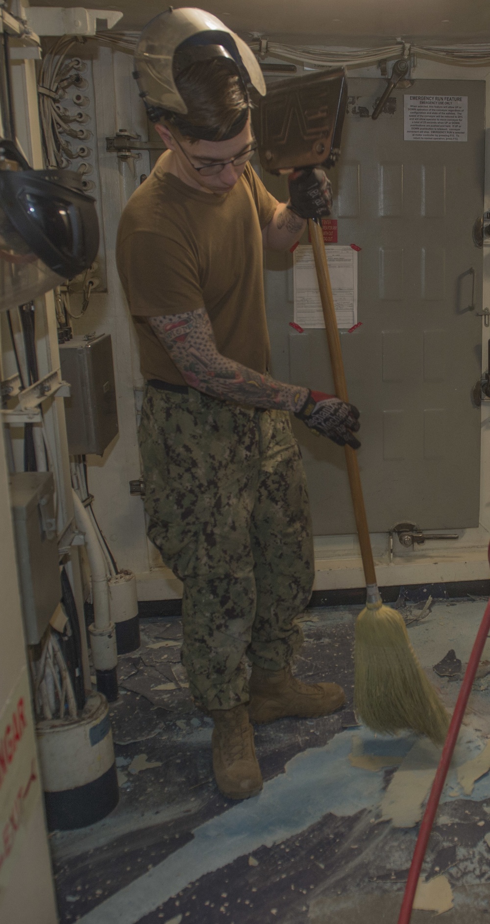 Sailor Sweeps Deck