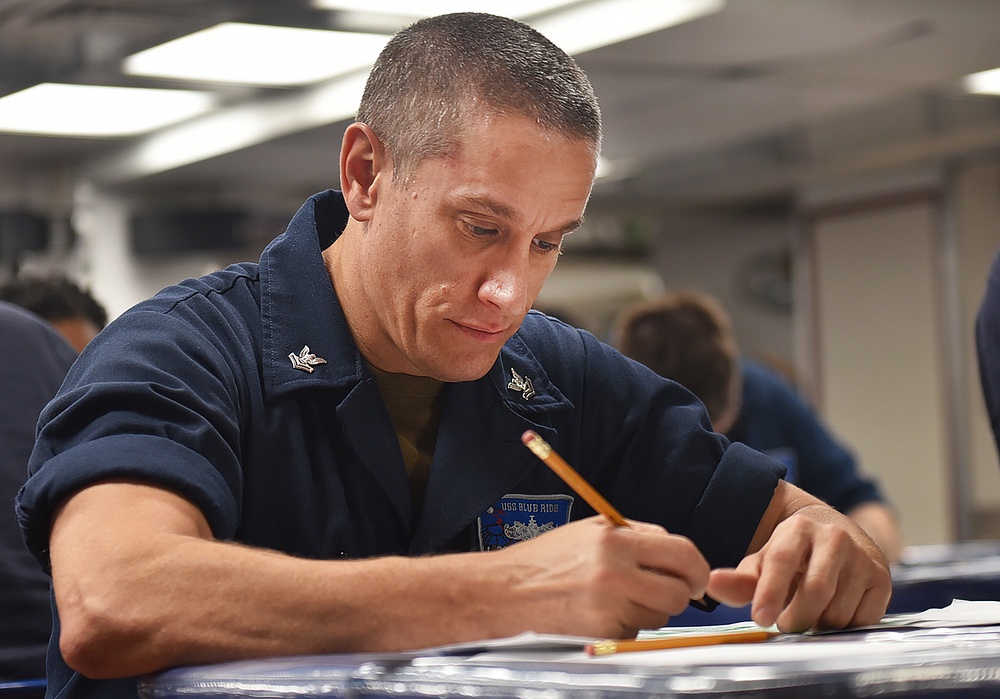 Sailors Take the E6 Advancement Exam Aboard Blue Ridge