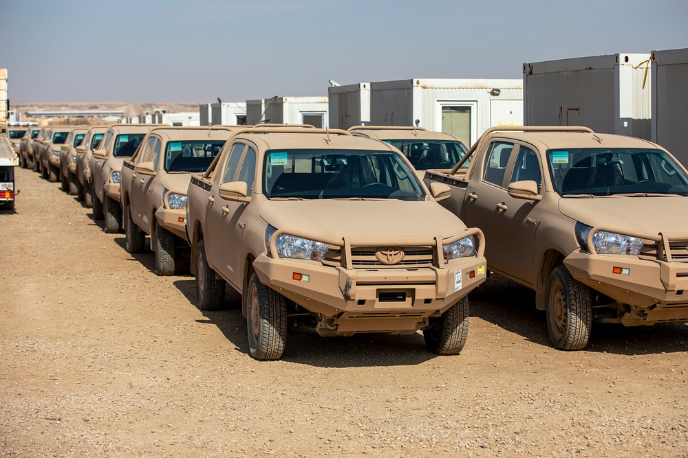 Coalition Forces transfer arms, equipment, vehicles to Iraqi forces