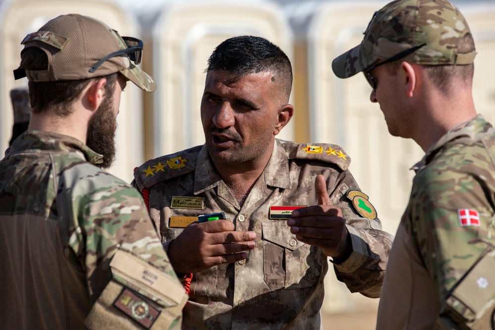 Coalition Forces transfer arms, equipment, vehicles to Iraqi forces