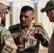 Coalition Forces transfer arms, equipment, vehicles to Iraqi forces