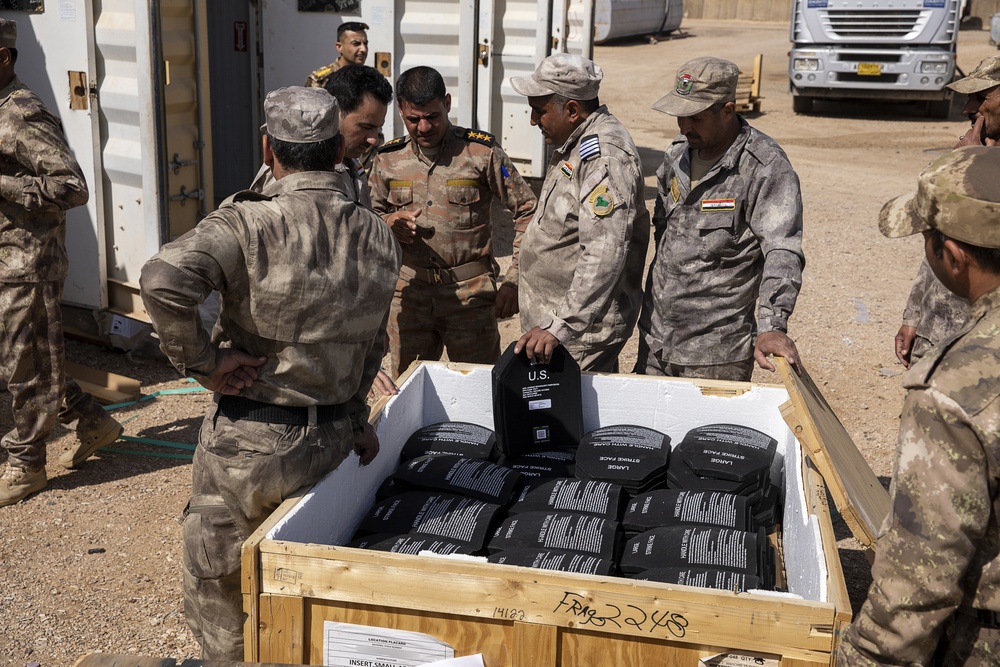 Coalition Forces transfer arms, equipment, vehicles to Iraqi forces