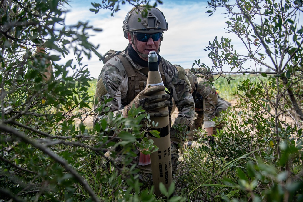 Explosive ordnance technicians conduct weapons cache prosecution training