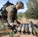 Explosive ordnance technicians conduct a simulated demolition shot, as part of surface cache prosecution training