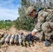 Explosive ordnance technicians conduct a simulated demolition shot, as part of surface cache prosecution training