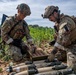 Explosive ordnance technicians conduct a simulated demolition shot, as part of surface cache prosecution training