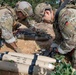 Explosive ordnance technicians conduct a simulated demolition shot, as part of surface cache prosecution training