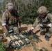 Explosive ordnance technicians conduct a simulated demolition shot, as part of surface cache prosecution training