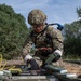 Explosive ordnance technicians conduct a simulated demolition shot, as part of surface cache prosecution training