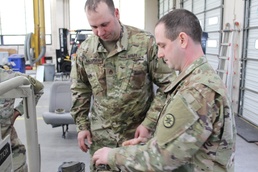 Sergeant Shullo disassembles water purification pump