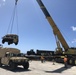 U.S. Navy Seabees with NMCB-5’s Detail Tinian embark to the island