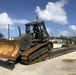 U.S. Navy Seabees with NMCB-5’s Detail Tinian embark to the island