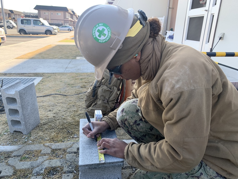 U.S. Navy Seabees deployed with NMCB-5’s Detail Iwakuni continue construction on environmental enclosures