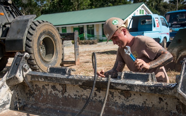 U.S. Navy Seabees deployed with NMCB-5’s Detail Palawan continue construction on Magsaysay Elementary School