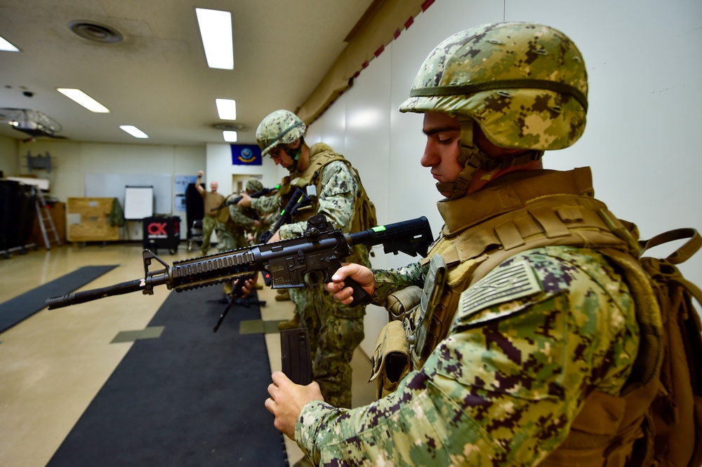 U.S. Navy Seabees with NMCB-5 train on board Camp Shields