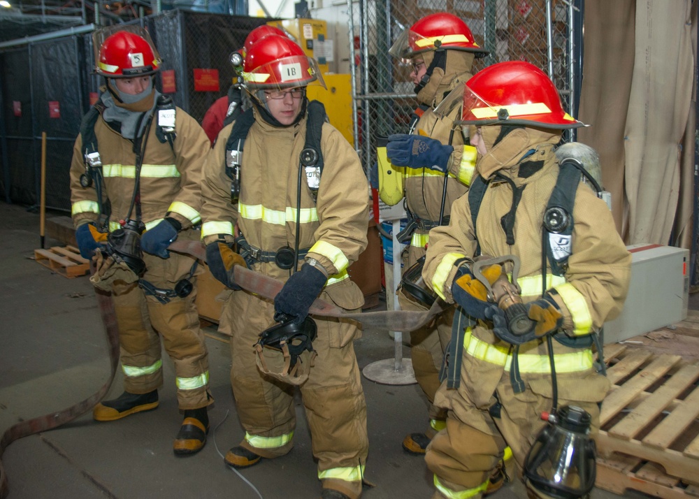 Hose team man the hose