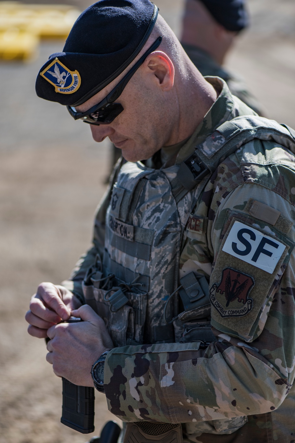 Loading magazines during &quot;Shoot, Move and Communicate&quot; drills at the 110th Wing