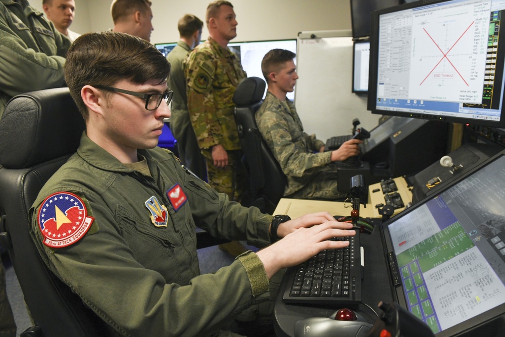 20th Attack Squadron sensor operator showcases MQ-9 Reaper flight simulator to Indiana State University Detachment 218 AFROTC cadets