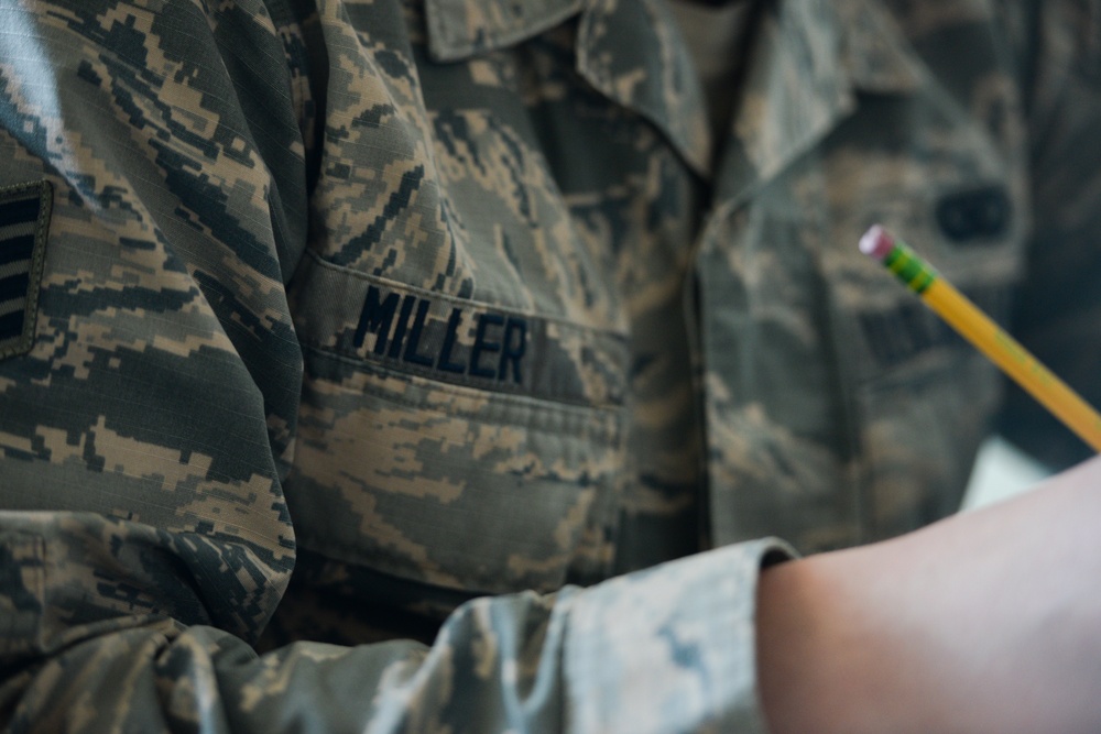 Staff Sgt. James Miller edits a story