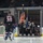 U.S. Sailors parade the colors at a Norfolk Admirals hockey game