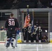 U.S. Sailors parade the colors at a Norfolk Admirals hockey game