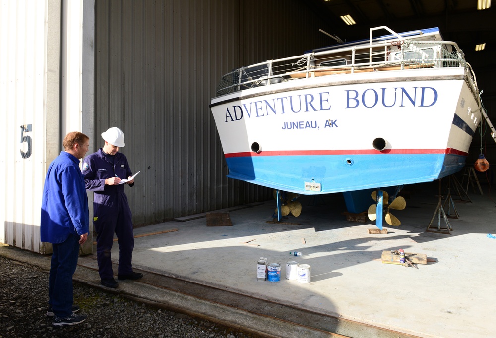 Coast Guard marine inspector inspects small passenger vessels