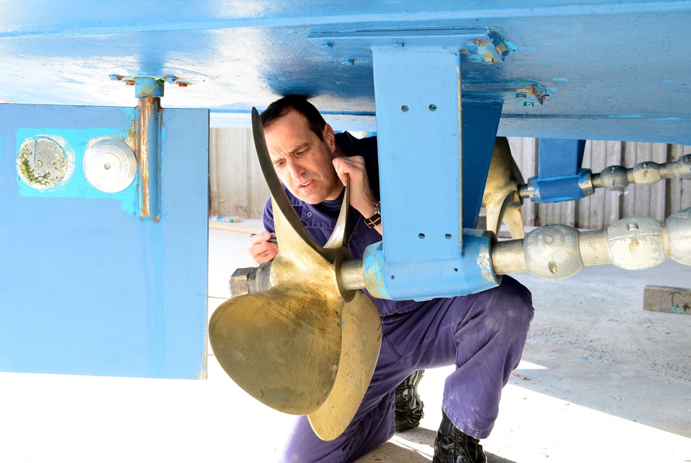 Coast Guard marine inspector inspects small passenger vessels