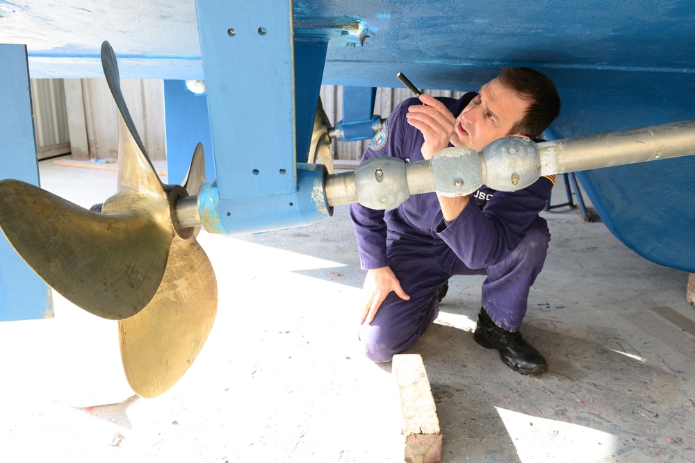 Coast Guard marine inspector inspects small passenger vessels