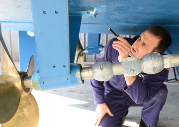 Coast Guard marine inspector inspects small passenger vessels