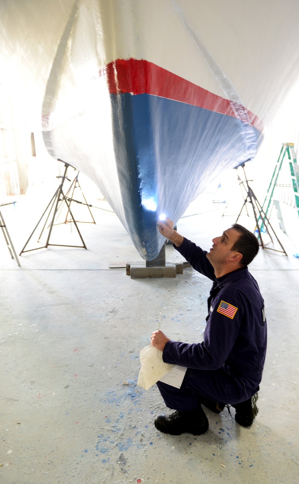 Coast Guard marine inspector inspects small passenger vessels