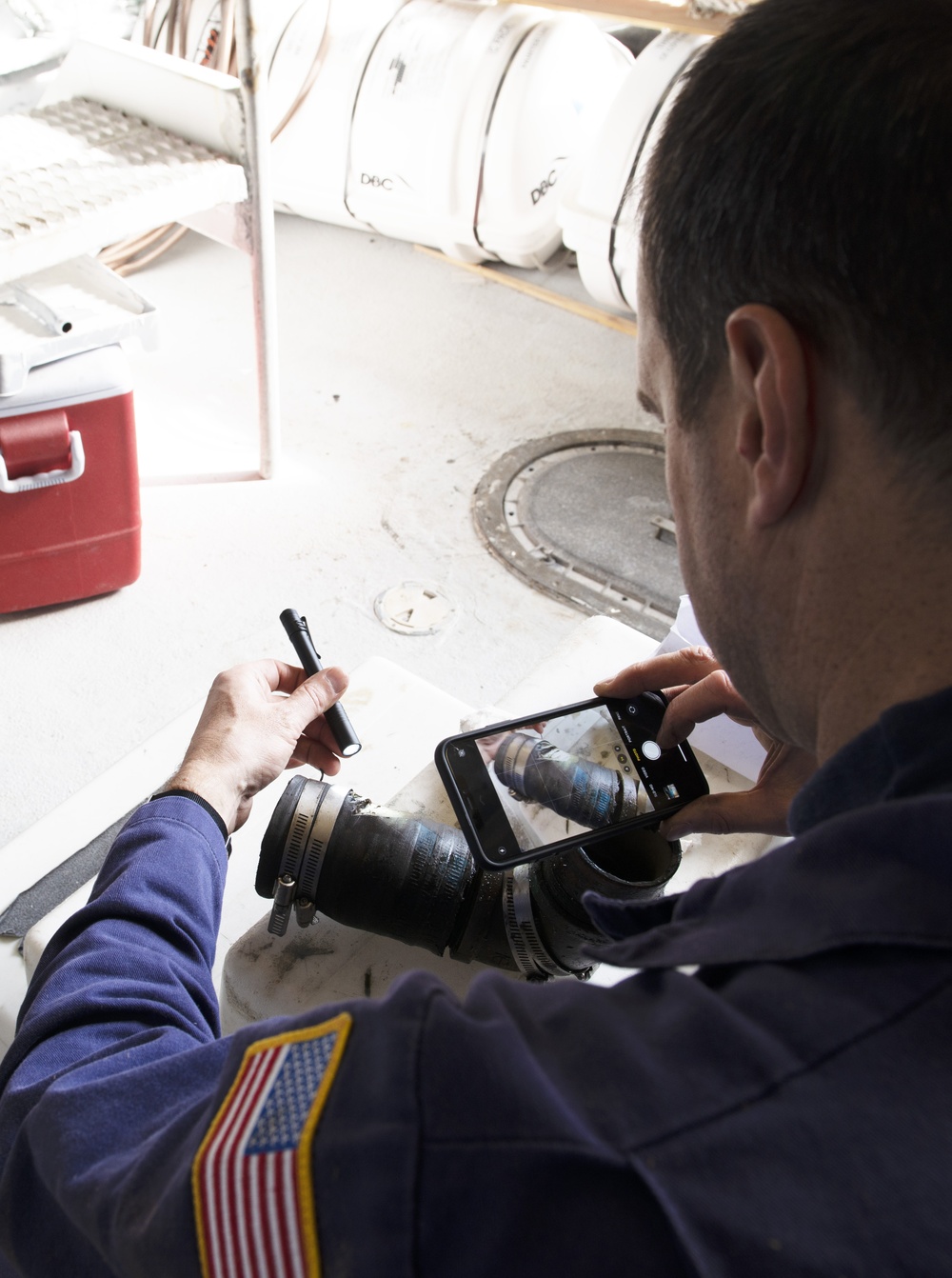 Coast Guard marine inspector inspects small passenger vessels