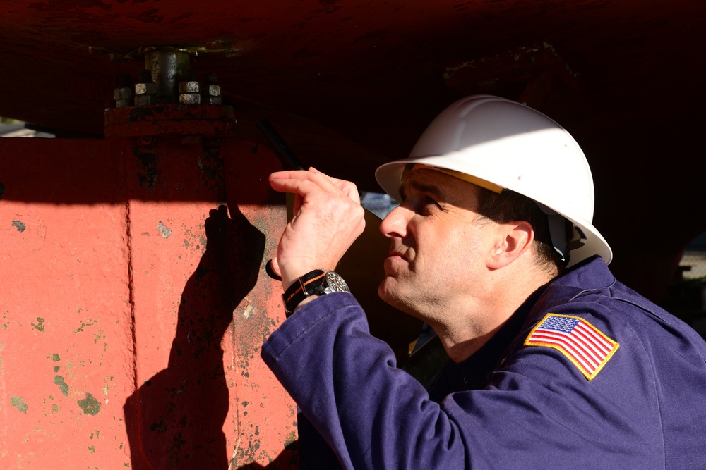 Coast Guard marine inspector inspects small passenger vessels