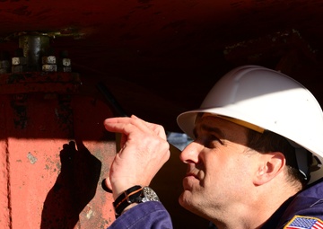Coast Guard marine inspector inspects small passenger vessels