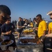 Sailors and Marine  take part in a steel beach picnic