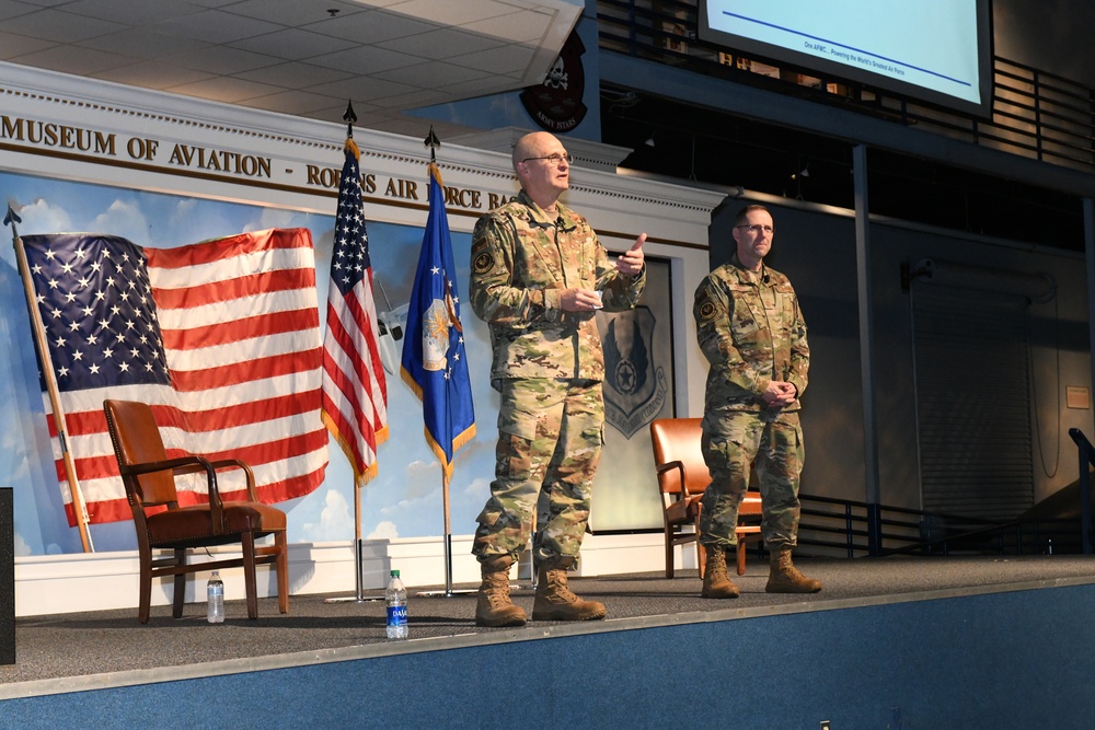 Gen. Arnold W. Bunch greets airman and civilians after Commander's Call